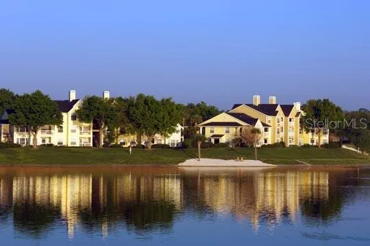a view of a lake with a house in the background