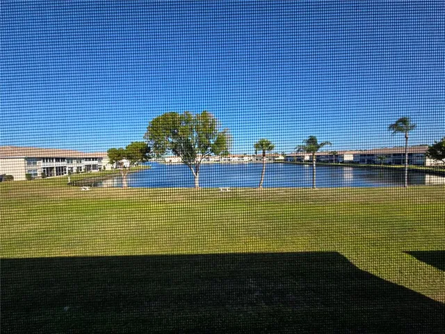 a view of a water fountain and an ocean