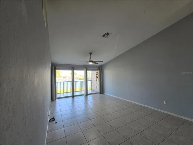 a view of an empty room and window