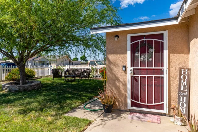 a kitchen with stainless steel appliances granite countertop a sink and a refrigerator
