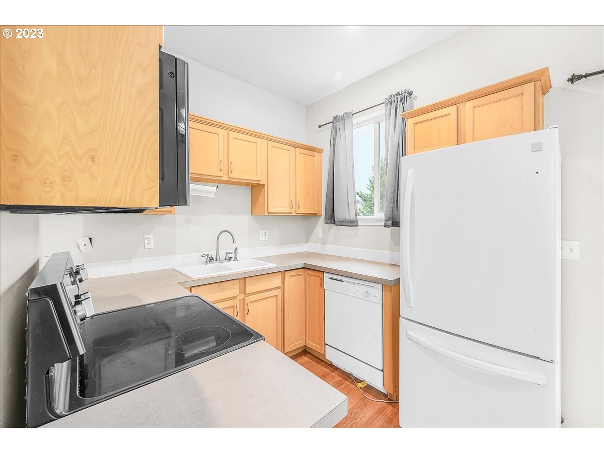 34970 Burt Road St. Helens, OR 97051 - Photo 13 of 33 a kitchen with stainless steel appliances granite countertop a sink refrigerator and microwave