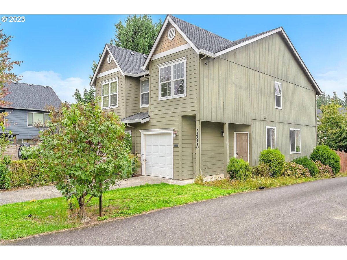 34970 Burt Road St. Helens, OR 97051 - Photo 2 of 33 a front view of a house with a yard and garage