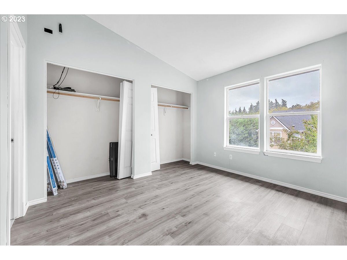 34970 Burt Road St. Helens, OR 97051 - Photo 23 of 33 a view of an empty room with wooden floor and a window