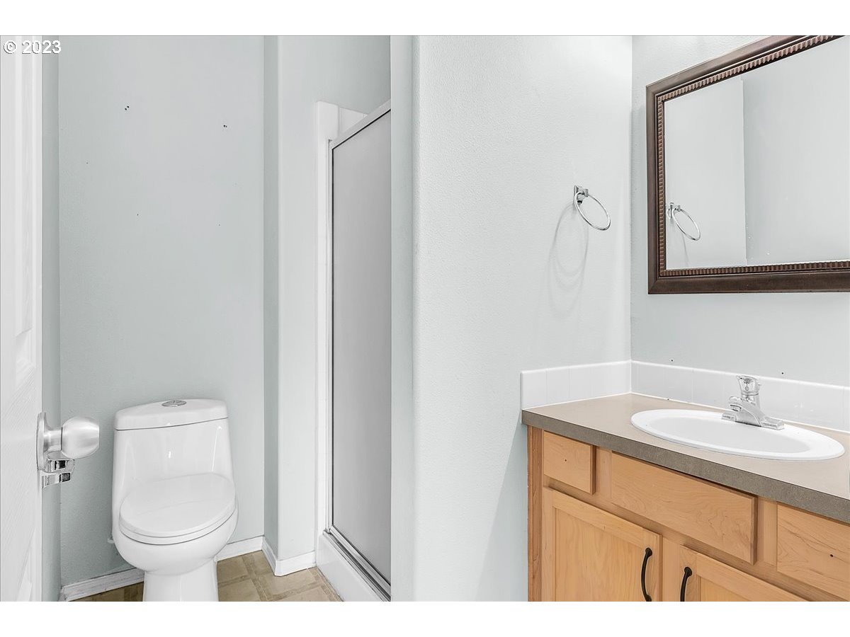 34970 Burt Road St. Helens, OR 97051 - Photo 26 of 33 a bathroom with a sink a toilet and mirror