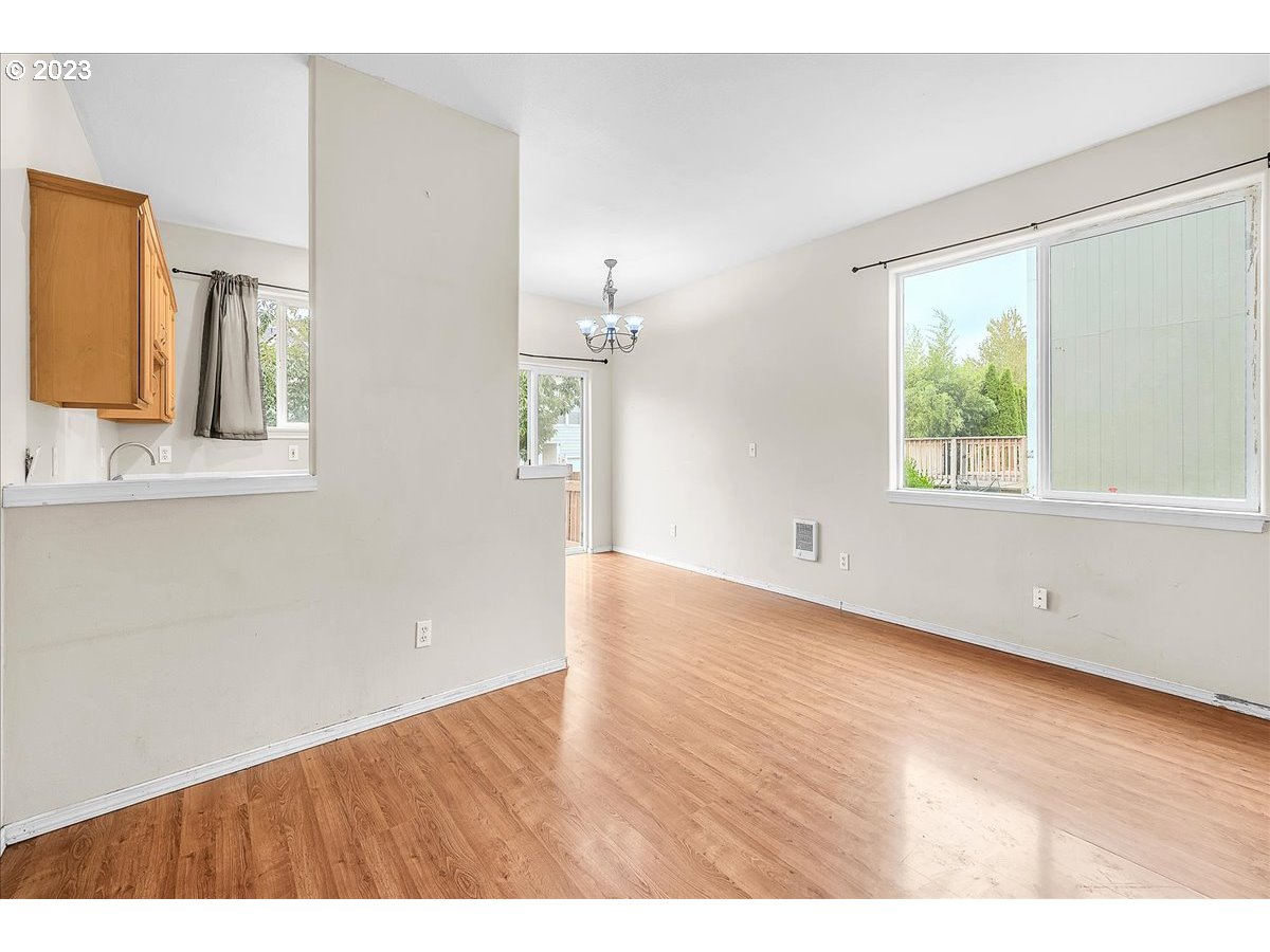 34970 Burt Road St. Helens, OR 97051 - Photo 10 of 33 a view of an empty room with wooden floor and a window