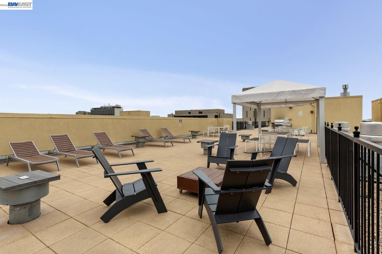 585 Ninth Street, Unit 443 Oakland, CA 94607 - Photo 27 of 32 a living room with patio furniture and a ocean view