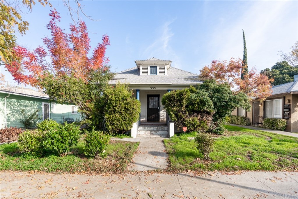 335 West 20th Street Merced, CA 95340 - Photo 1 of 1 a front view of a house with garden