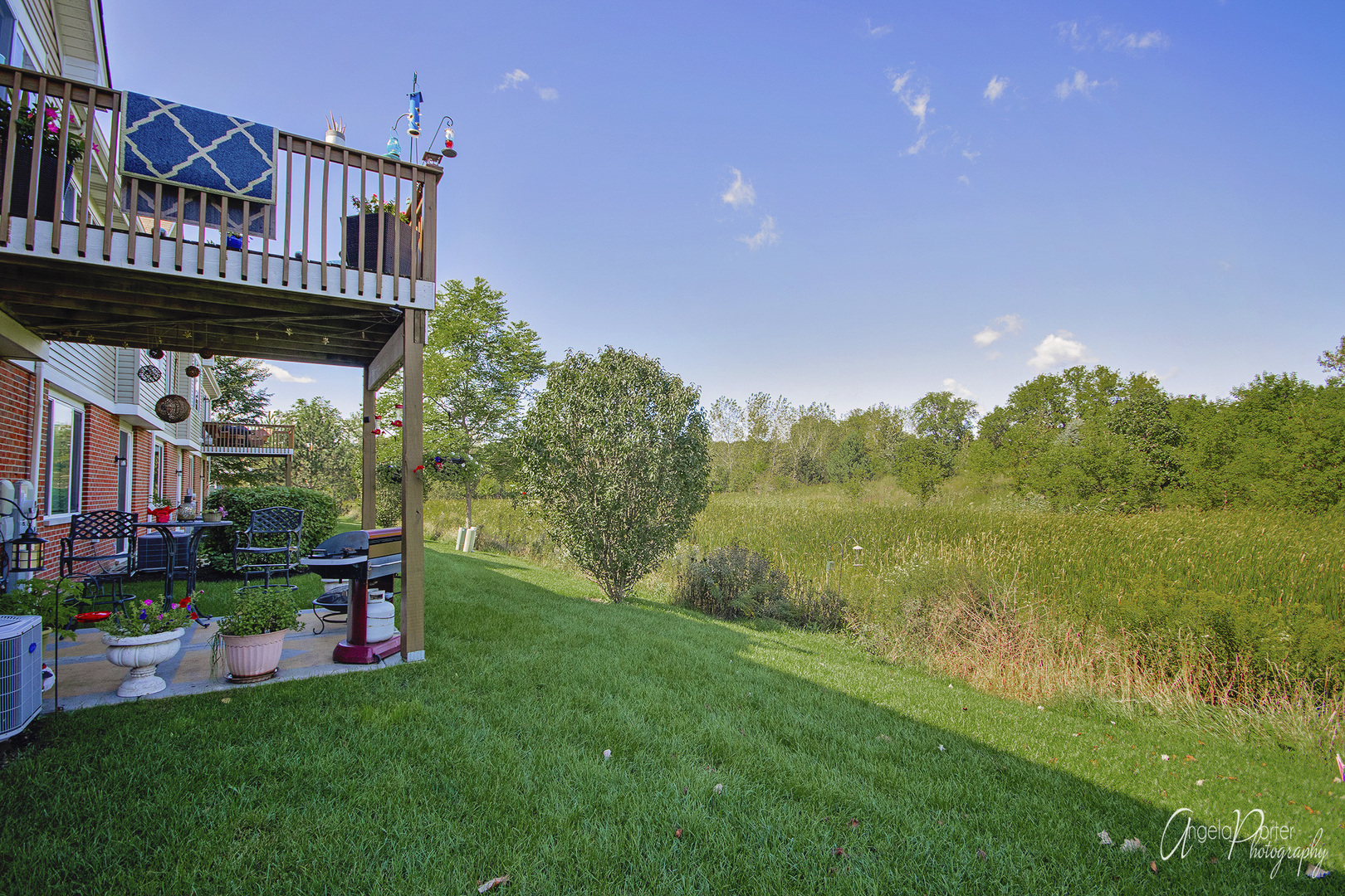 1401 Draper Road, Unit 164 McHenry, IL 60050 - Photo 22 of 24 a view of an house with backyard and patio