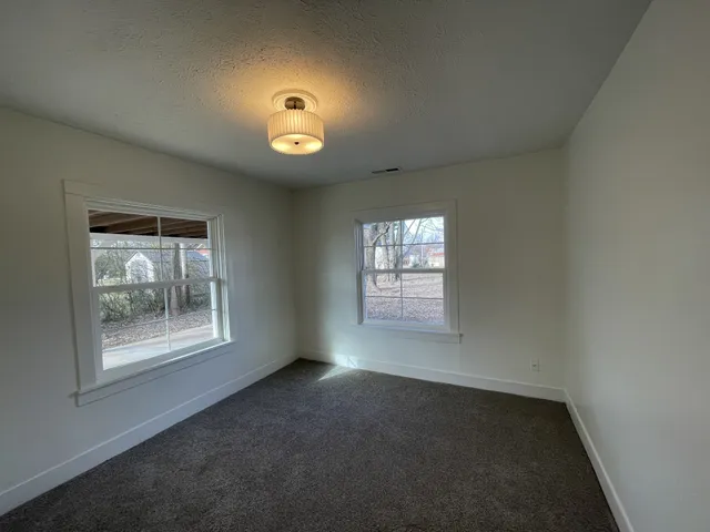 an empty room with windows