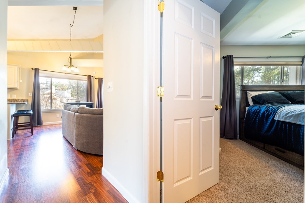 750 Whittenton Street, Unit 523 Taunton, MA 02780 - Photo 14 of 37 a view of a bedroom with furniture and wooden floor