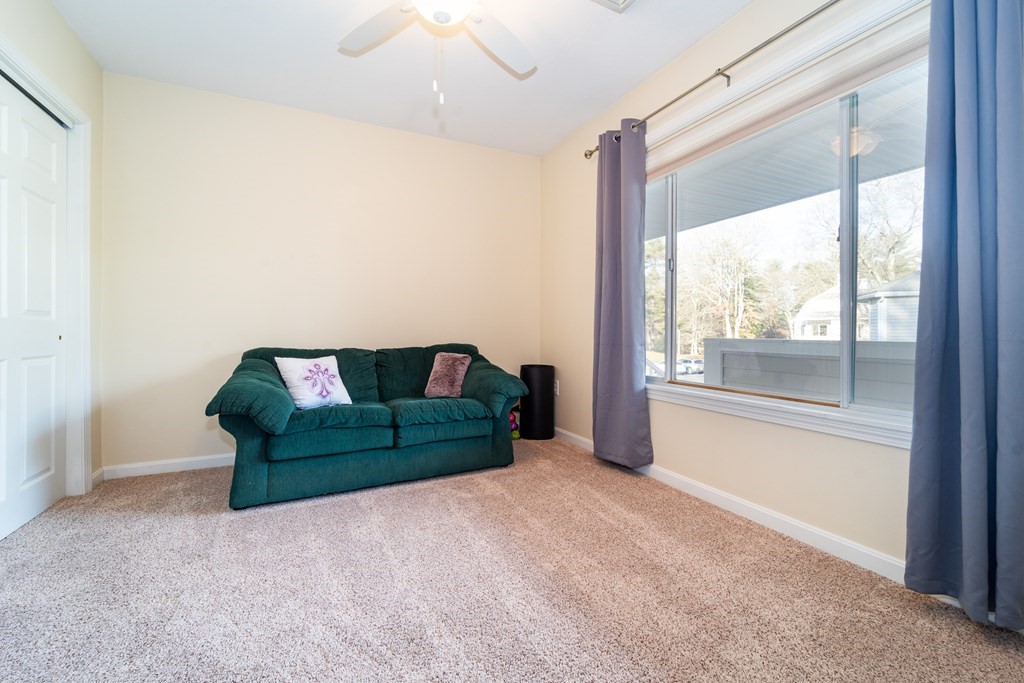 750 Whittenton Street, Unit 523 Taunton, MA 02780 - Photo 21 of 37 a living room with furniture and a window