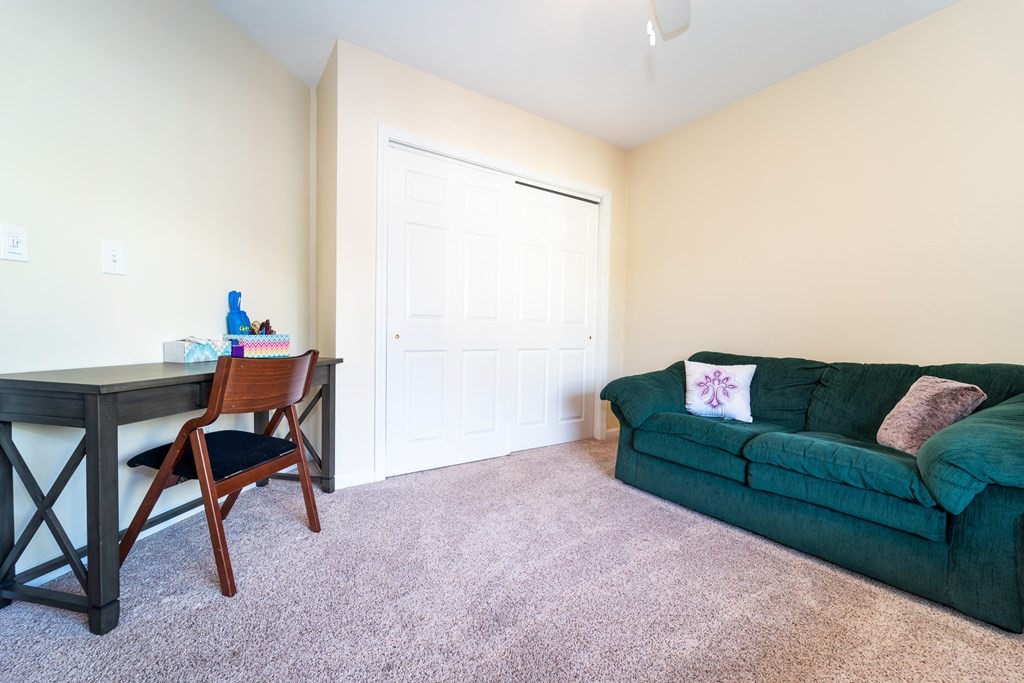 750 Whittenton Street, Unit 523 Taunton, MA 02780 - Photo 22 of 37 a living room with furniture and a window