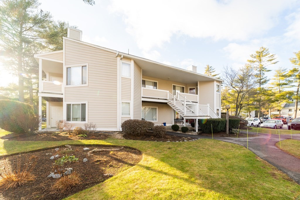 750 Whittenton Street, Unit 523 Taunton, MA 02780 - Photo 27 of 37 a view of a house with a swimming pool
