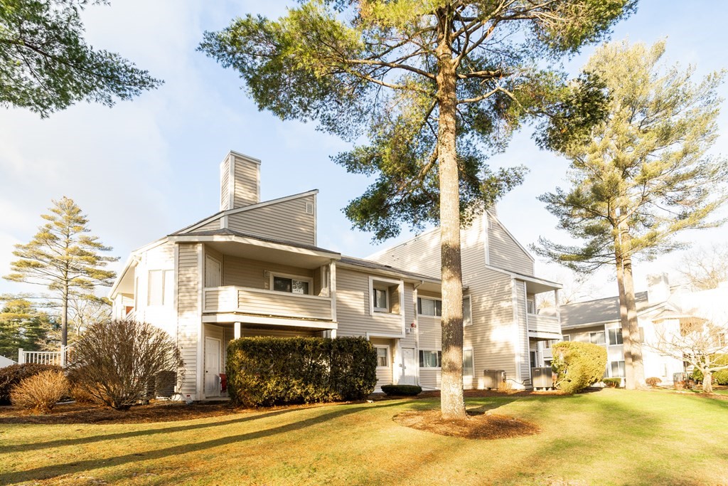 750 Whittenton Street, Unit 523 Taunton, MA 02780 - Photo 30 of 37 a front view of a building with streets and trees