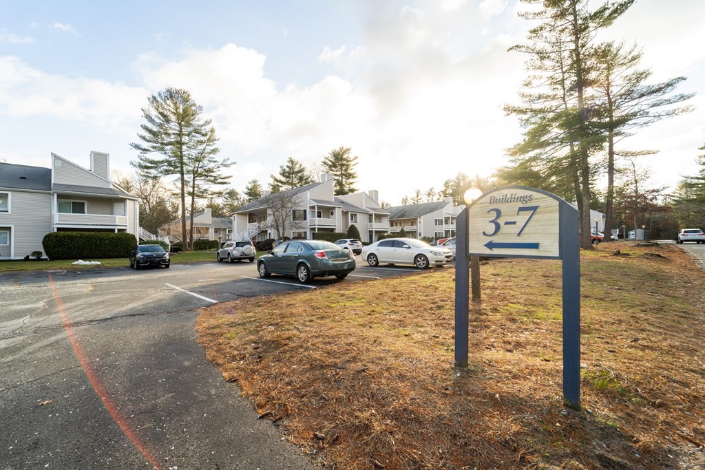 750 Whittenton Street, Unit 523 Taunton, MA 02780 - Photo 35 of 37 a street view with parked cars