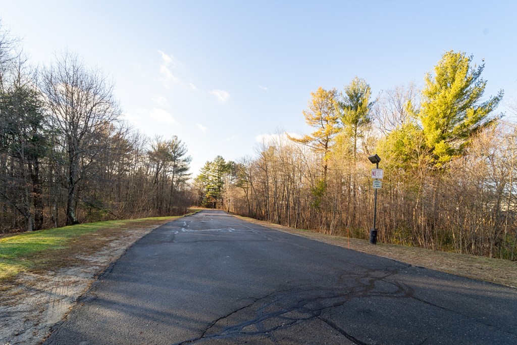750 Whittenton Street, Unit 523 Taunton, MA 02780 - Photo 36 of 37 a view of a road with a yard