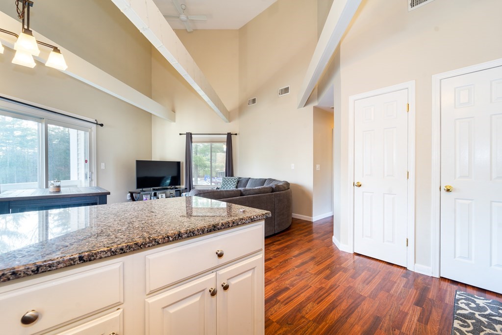 750 Whittenton Street, Unit 523 Taunton, MA 02780 - Photo 8 of 37 a spacious bathroom with a granite countertop sink a mirror and shower
