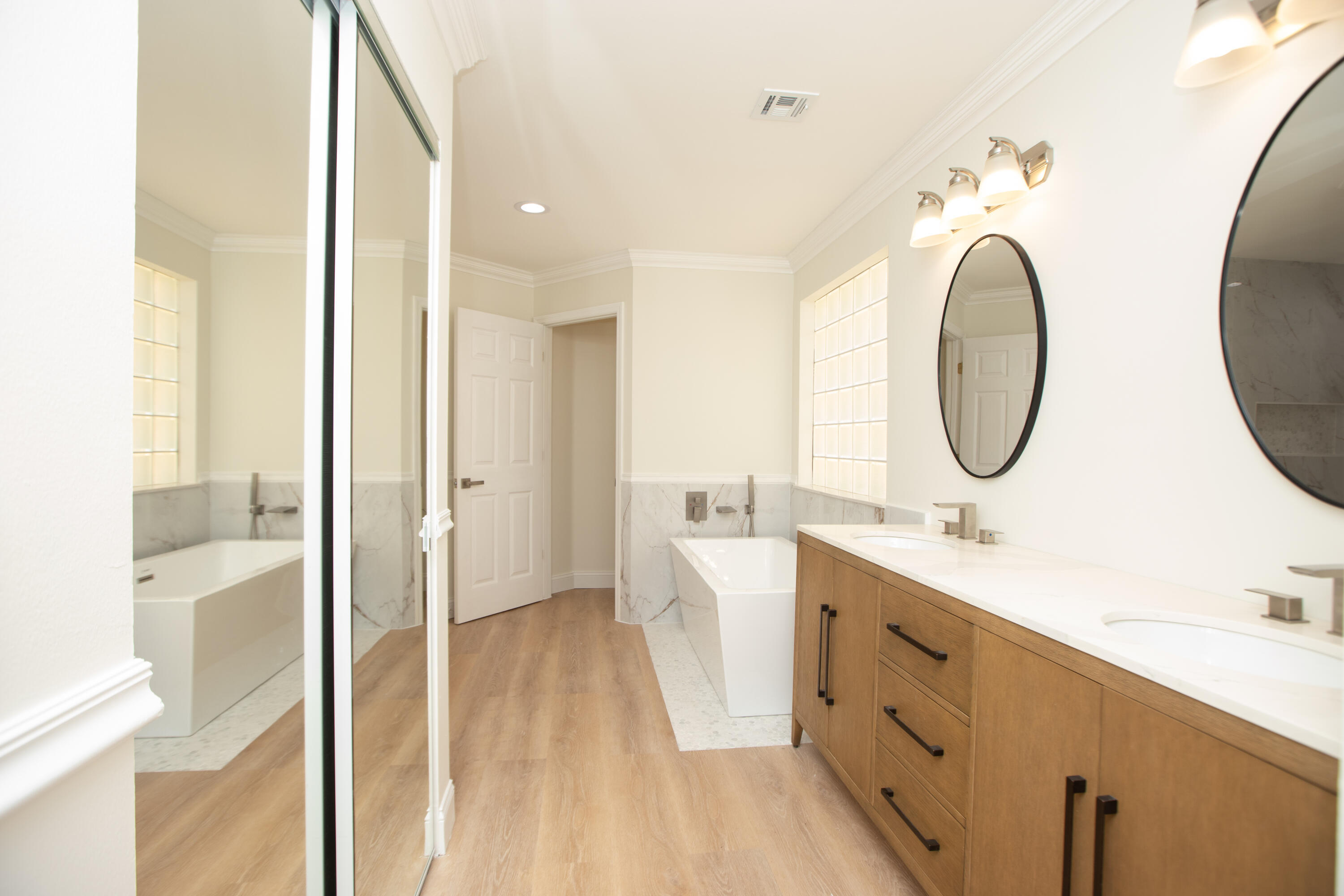 10821 La Salinas Circle Boca Raton, FL 33428 - Photo 17 of 64 a spacious bathroom with a double vanity sink mirror and a shower
