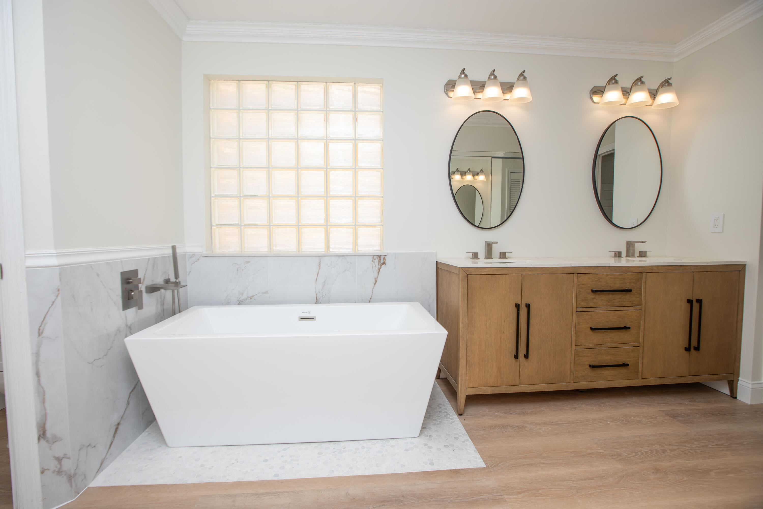 10821 La Salinas Circle Boca Raton, FL 33428 - Photo 18 of 64 a bathroom with a bathtub a mirror and a sink