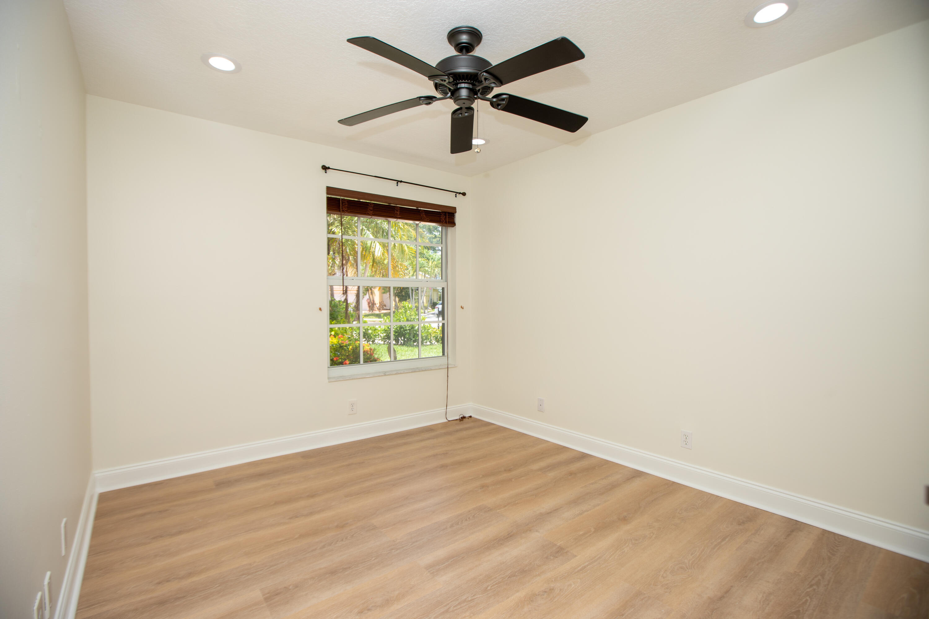 10821 La Salinas Circle Boca Raton, FL 33428 - Photo 24 of 64 an empty room with a window and a fan
