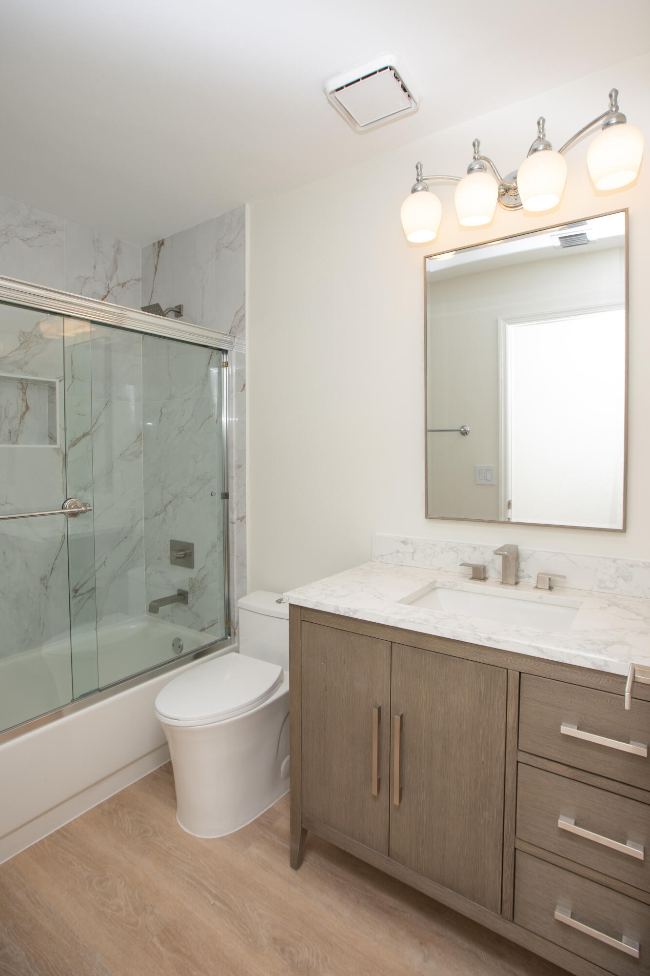 10821 La Salinas Circle Boca Raton, FL 33428 - Photo 27 of 64 a bathroom with a double vanity sink mirror and toilet