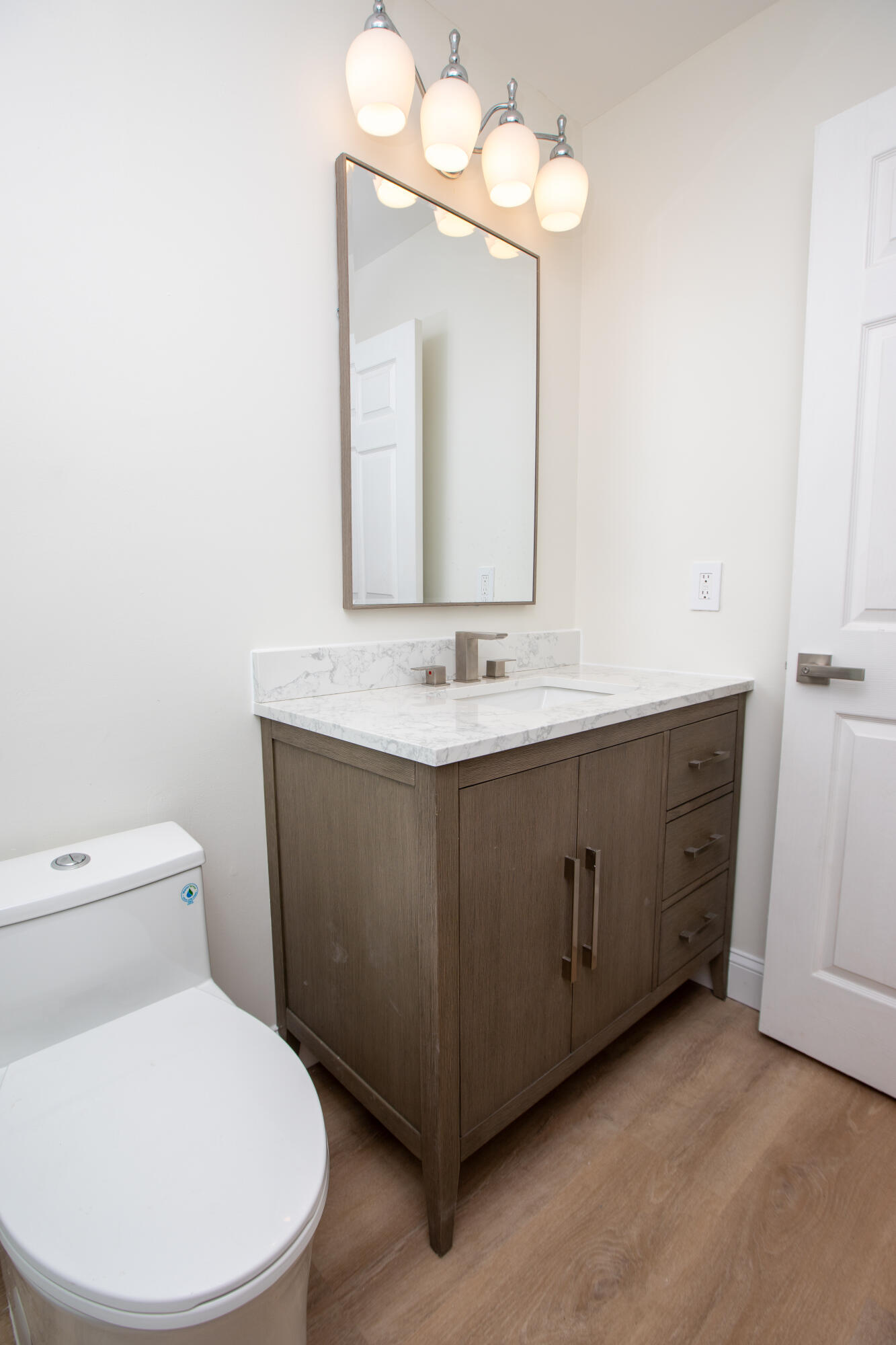 10821 La Salinas Circle Boca Raton, FL 33428 - Photo 28 of 64 a bathroom with a toilet sink and mirror