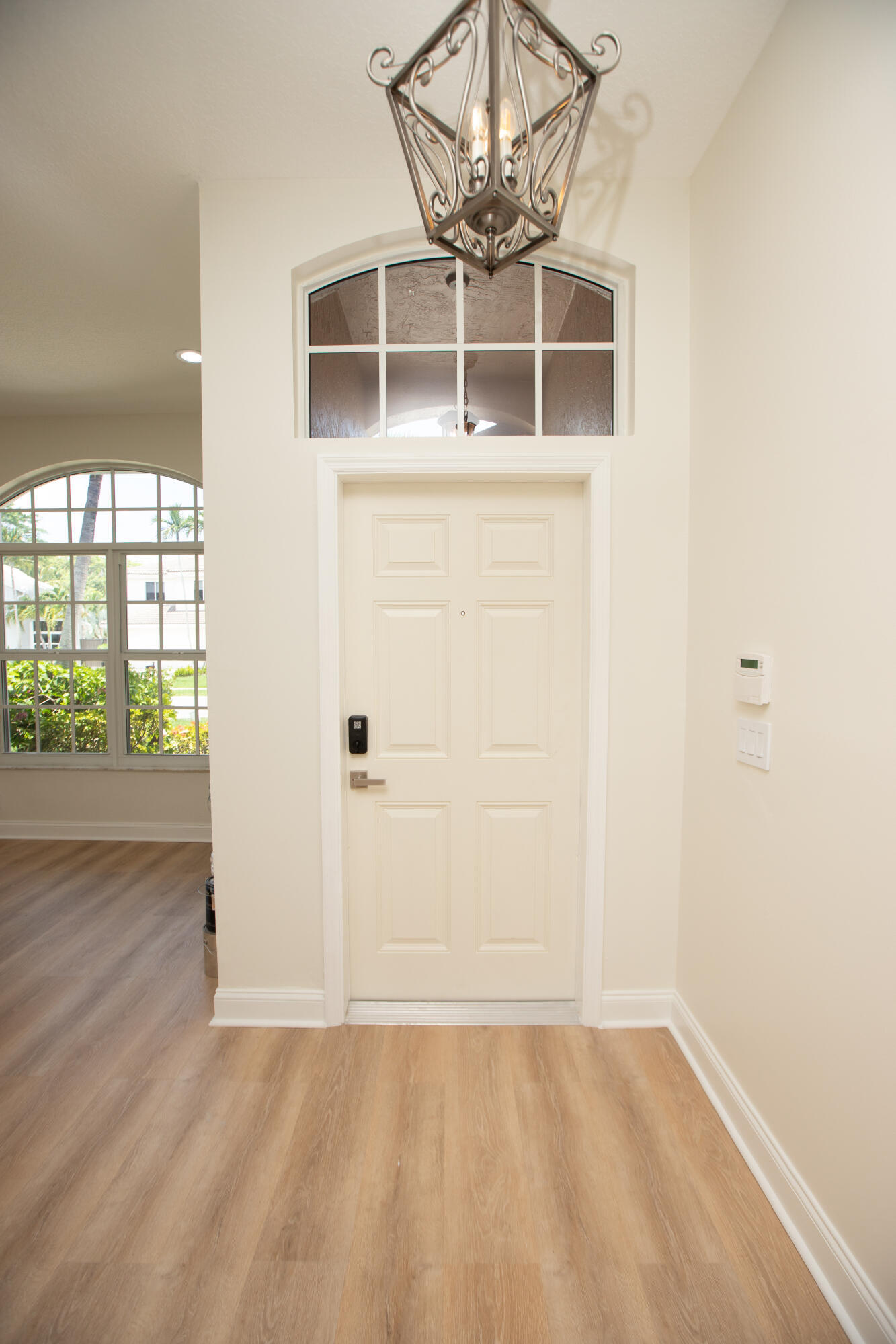 10821 La Salinas Circle Boca Raton, FL 33428 - Photo 39 of 64 an empty room with wooden floor and windows