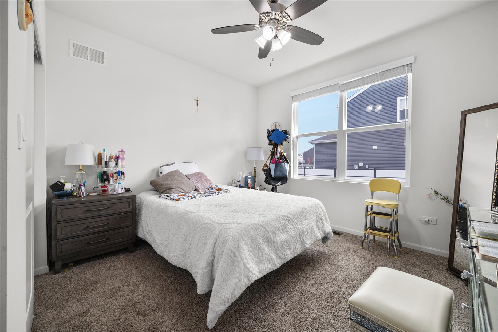 10122 Jonamac Avenue Huntley, IL 60142 - Photo 12 of 27 a bedroom with a bed and a chandelier