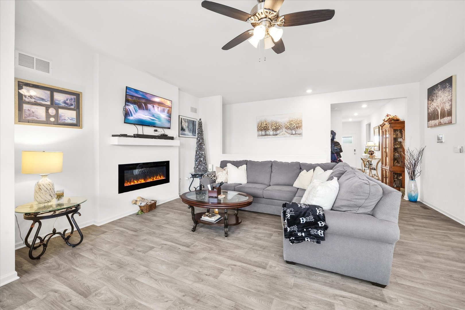10122 Jonamac Avenue Huntley, IL 60142 - Photo 14 of 27 a living room with furniture and a fireplace