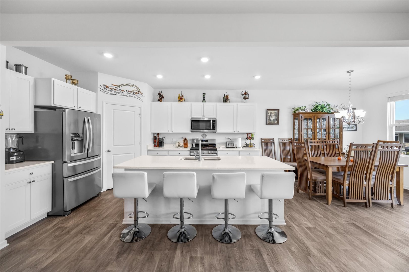 10122 Jonamac Avenue Huntley, IL 60142 - Photo 15 of 27 a view of kitchen with stainless steel appliances refrigerator dining table and chairs