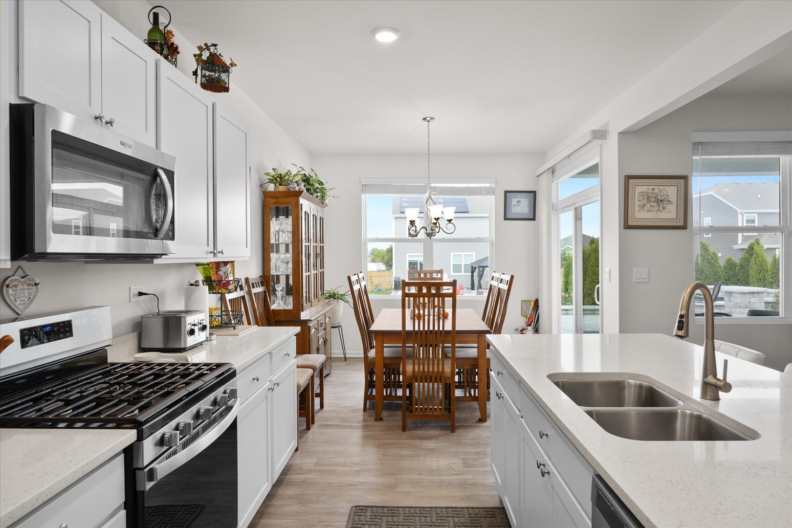 10122 Jonamac Avenue Huntley, IL 60142 - Photo 17 of 27 a kitchen with granite countertop a stove and a sink