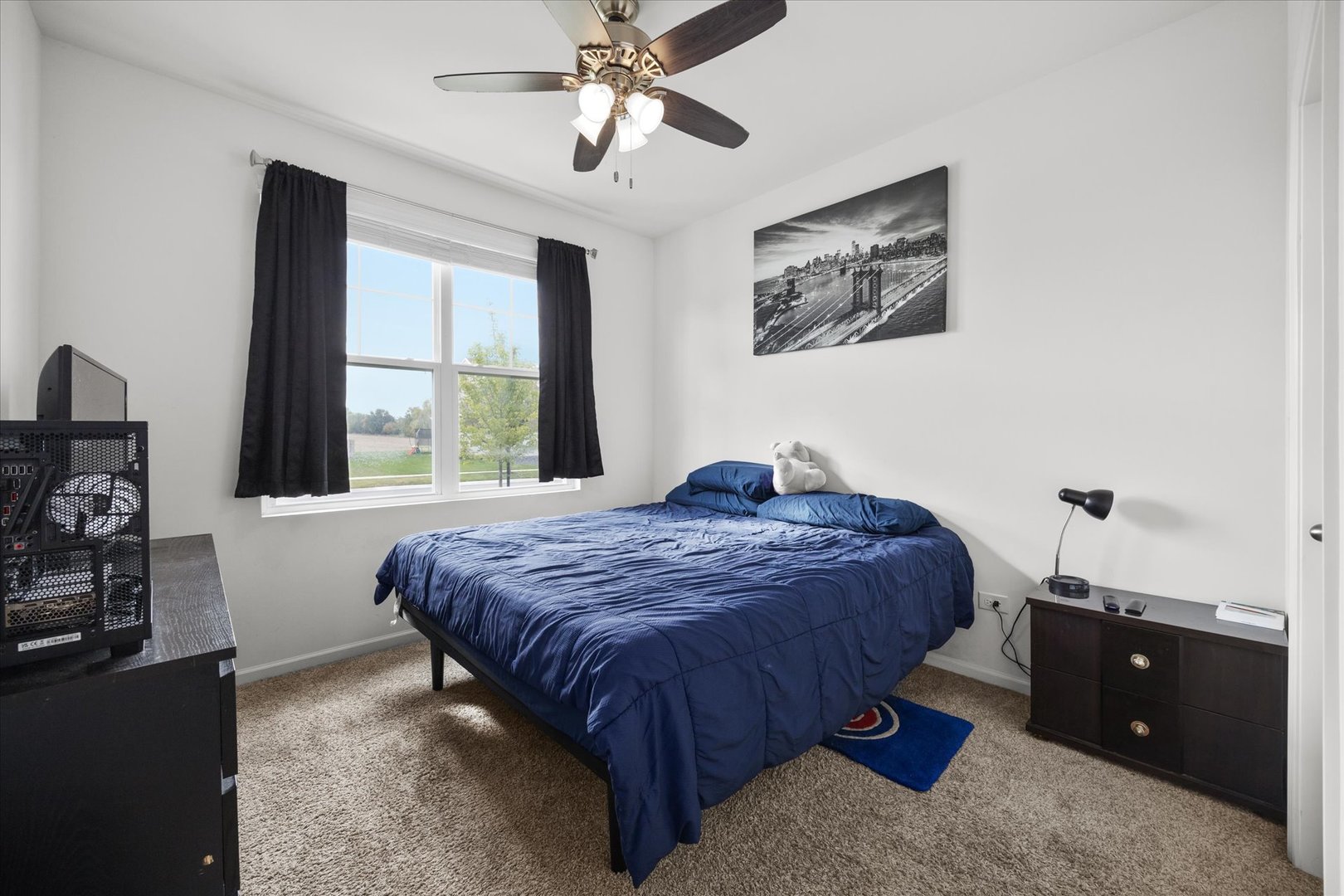 10122 Jonamac Avenue Huntley, IL 60142 - Photo 8 of 27 a bedroom with a bed and a window