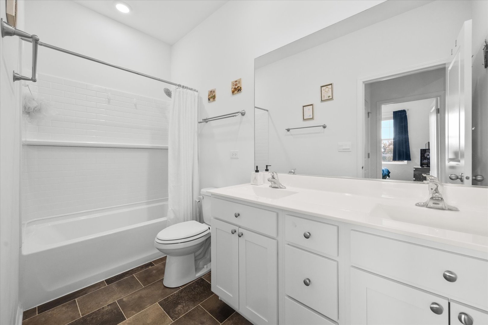 10122 Jonamac Avenue Huntley, IL 60142 - Photo 9 of 27 a bathroom with a sink toilet and shower