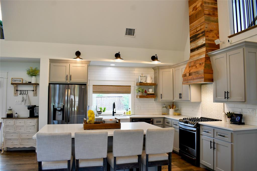 1304 Tinker Road Colleyville, TX 76034 - Photo 7 of 28 a view of kitchen with cabinets and wooden floor
