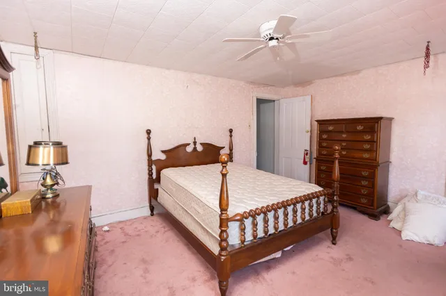 a bed room with a bed and a chandelier