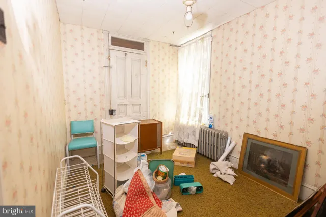 a bed room with a bed and a window