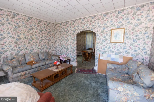 a living room with furniture and a table