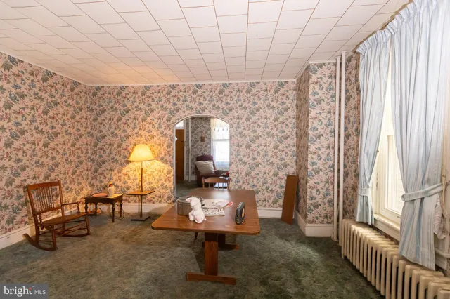 a bedroom with a bed and dresser