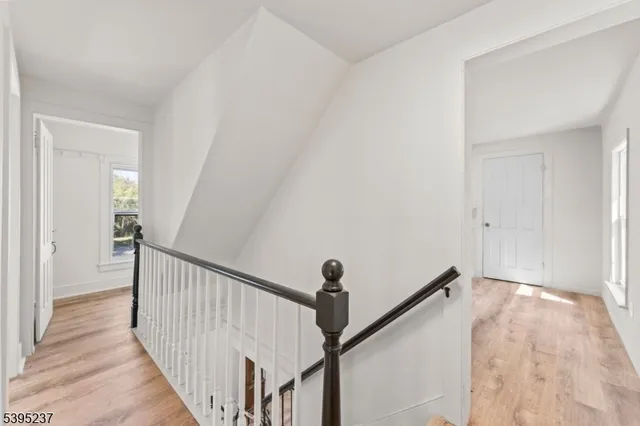 a view of a hallway view with staircase