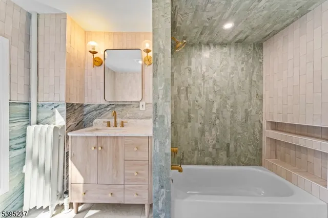 a bathroom with a bathtub and a sink