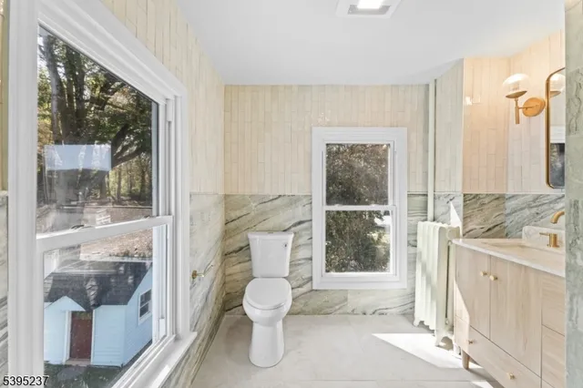 a bathroom with a toilet sink and shower