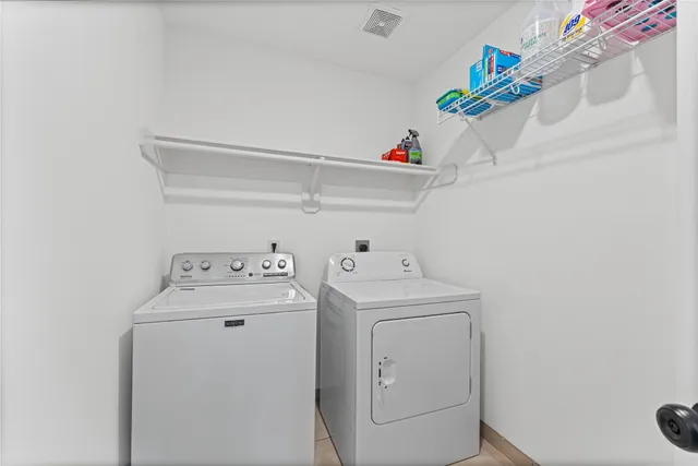 a bathroom with a double vanity sink toilet and shower