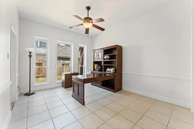 a view of an entryway with a chandelier fan