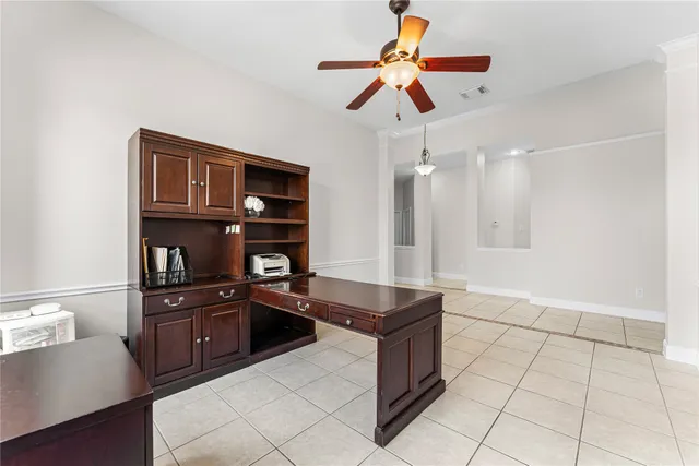a view of workspace with furniture and window