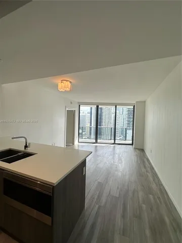 a large bathroom with a sink and mirror