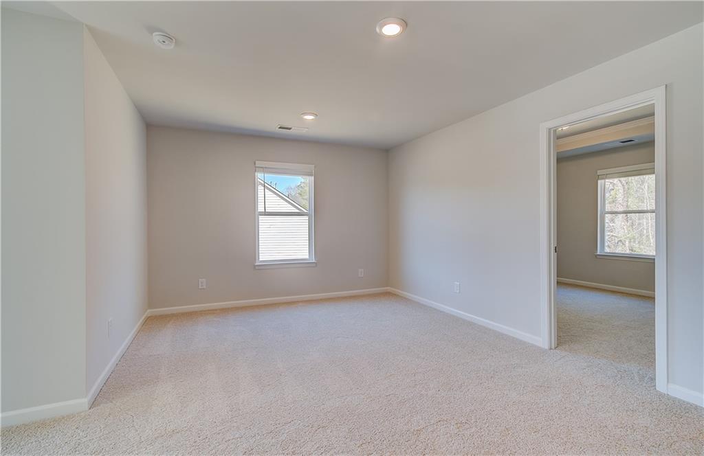 228 Ruthe Cove Locust Grove, GA 30248 - Photo 17 of 31 a view of an empty room with a window