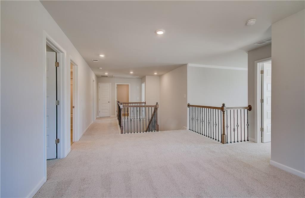 228 Ruthe Cove Locust Grove, GA 30248 - Photo 18 of 31 a view of a hallway with a staircase