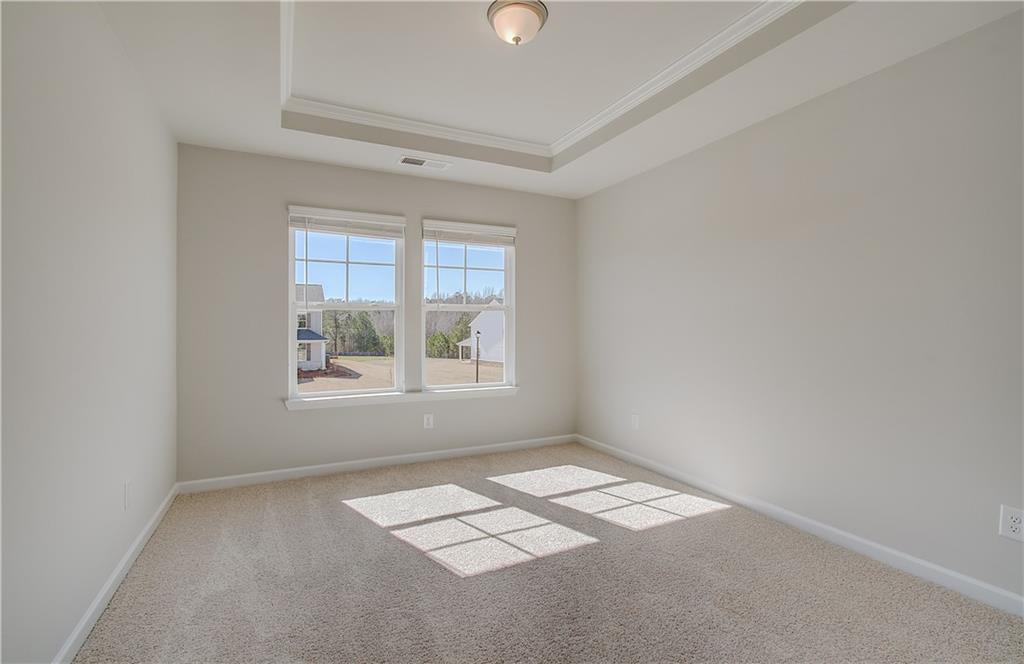 228 Ruthe Cove Locust Grove, GA 30248 - Photo 19 of 31 an empty room with a window