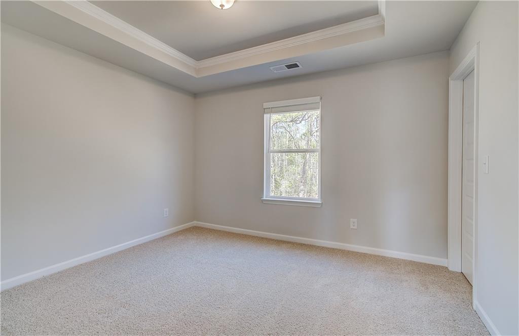 228 Ruthe Cove Locust Grove, GA 30248 - Photo 20 of 31 an empty room with a window