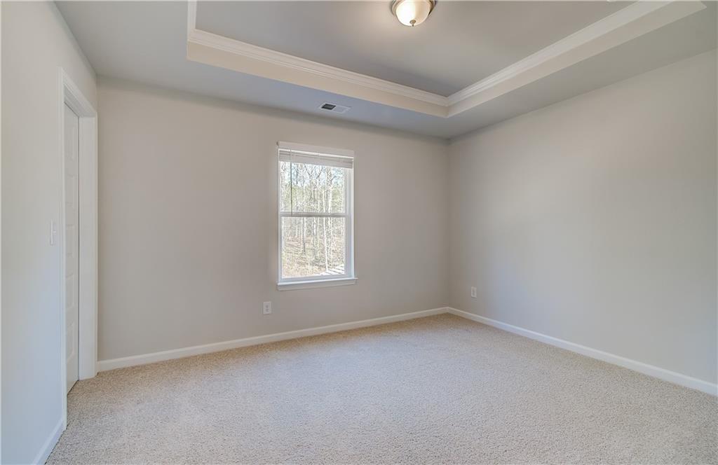 228 Ruthe Cove Locust Grove, GA 30248 - Photo 21 of 31 an empty room with a window